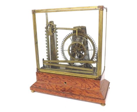 Reproduction skeletonised water wheel clock, under a glazed brass framed case and upon a stepped wooden base, 18.75" high