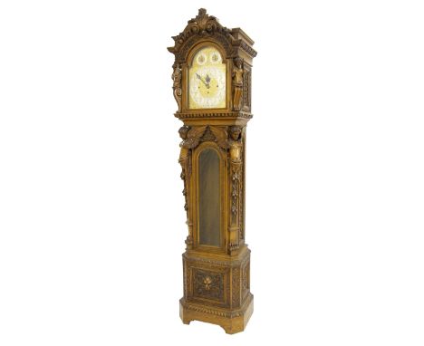 Impressive James Elliott carved oak three train musical longcase clock, the 13 3/8" brass arched dial signed Russells LImited