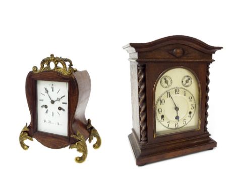 Oak three train mantel clock striking on five rods, the 7" silvered arched dial with slow/fast and chime/silent subsidiary di