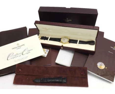 Fine Patek Philippe Calatrava automatic 18k yellow gold gentleman's wristwatch, ref. 5026J, egg shell white dial with Roman n