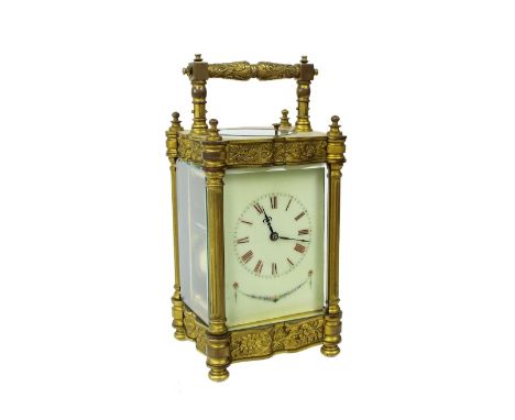 French repeater carriage clock striking on a gong, the cream dial plate within an ornate floral cast pillared brass case, 8" 