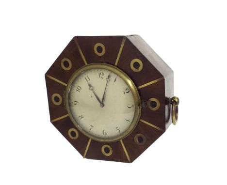 Small mahogany octagonal sedan type wall clock, the 4" silvered dial within a case inlaid in brass and ebony, with brass ring