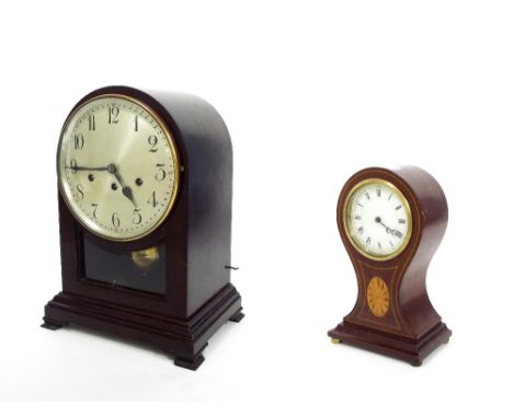 Junghans stained wooden three train mantel clock, the 7" silvered dial over a pendulum window and stepped base, surmounted by