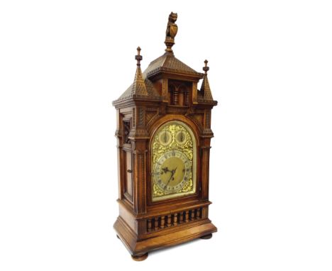 Good English oak triple fusee boardroom mantel clock, the movement chiming the hours and quarters on five gongs, the 9" brass