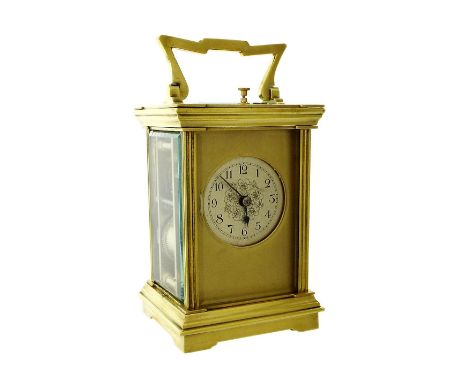 Small French repeater carriage clock striking on a gong, the 1.75" foliate engraved silvered dial within a gilt mask and gild