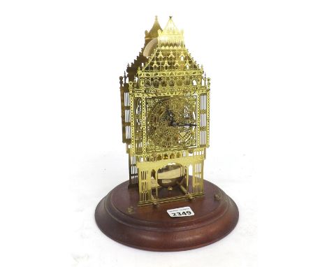 Contemporary brass single train skeleton clock, upon a circular stepped wooden base (lacks dome), 11" high overall (pendulum 