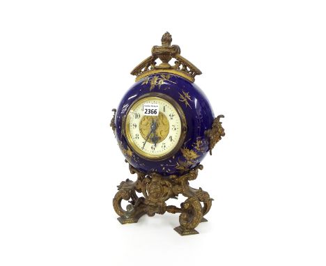 Pottery and gilt metal mounted mantel clock timepiece, the 4.25" cream chapter ring enclosing a pierced gilt metal centre wit