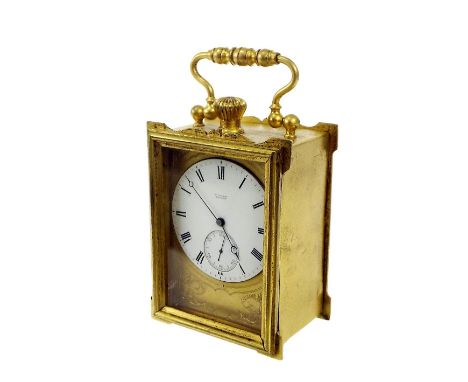 Small gilt cased travel clock timepiece, the 1.75" white dial and movement signed Vuillamy, London, with subsidiary seconds d