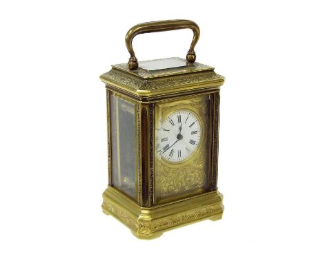 Good miniature brass carriage clock timepiece, the 1" dial within a foliate engraved gilt mask and gorge case, 3.75" high