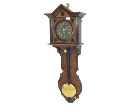 Oak single weight wall clock, the 6.5" black dial over a flat shaped trunk inscribed with the registered maker's trademark O.