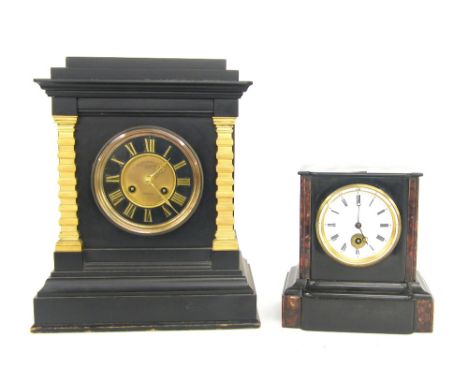 Large black slate two train mantel clock striking on a gong, the 4.5" slate chapter ring enclosing a recessed gilt centre sig
