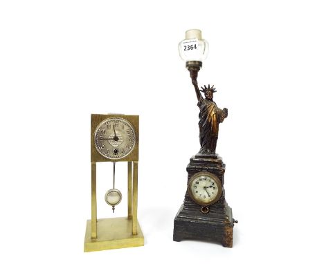 Novelty Statue of Liberty mantel timepiece, the 2" silvered dial within a pedestal stepped base surmounted by the Statue of L