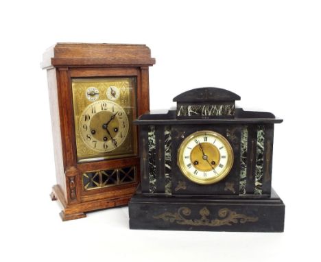 Junghans oak three train mantel clock striking on three rods and a gong, the rectangular brass engraved dial with silvered ch