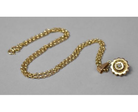 A Victorian 14ct Gold and Diamond Pendant on a 9ct Gold Chain, Centre Stone 1/16th of a Carat. 7.7gms 