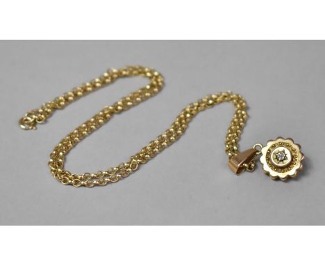 A Victorian 14ct Gold and Diamond Pendant on a 9ct Gold Chain, Centre Stone 1/16th of a Carat. 7.7gms 