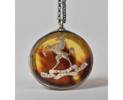 A Tortoiseshell and Silver Inlaid Pendant, Featuring Rearing Horse above Ribbon, 'Royal Invicta Kent West' on a White Metal C