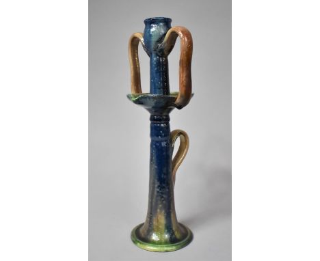 A Tall Majolica Glazed Stoneware Arts and Crafts Candlestick, 34cm high 