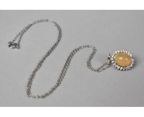 A 14ct White Gold, Diamond and Ethiopian Opal Pendant on Silver Chain. 22mm Drop, Pendant 2.4gms 