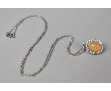 A 14ct White Gold, Diamond and Ethiopian Opal Pendant on Silver Chain. 22mm Drop, Pendant 2.4gms 