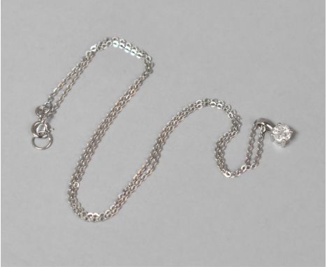 A 18ct White Gold and Diamond Pendant on a 18ct White Gold Chain. Pendant Made from Four Triangular Diamonds to Simulate a So