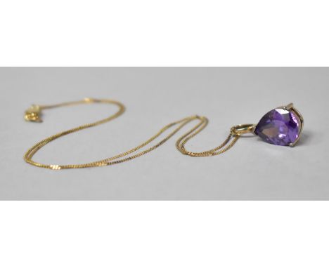 A 9ct Gold Chain with Gilt Silver Pendant housing Large Teardrop Shaped Amethyst Stone 