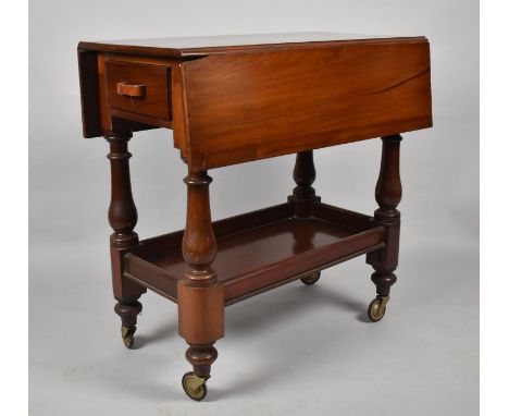 A Late Victorian Mahogany Drop Leaf Trolley with Galleried Stretcher Shelf and Two Drawers, 76cm wide 