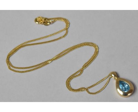A 9ct Gold Pendant Housing Teardrop Shaped Topaz on a 9ct Gold Chain. 4.4gms 