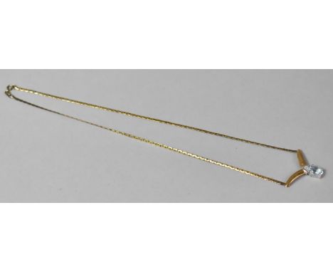 A 9ct Gold and Aquamarine Teardrop Shaped Pendant on a 9ct Gold Chain Surmounted by a Trio of Diamonds, 5.5gms 