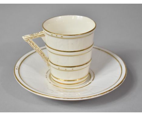 A Royal Worcester Aesthetic Cream and Gilt Coffee Can and Saucer 