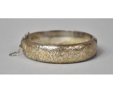 A Silver Bangle with Engraved Floriate Decoration, Birmingham Hallmark 
