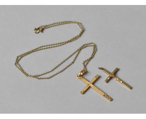 A 9ct Gold Crucifix on a 9ct Gold Chain and One Yellow Metal Example (Stamped but Illegible) 