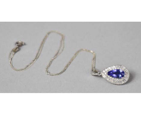A 14ct White Gold, Diamond and 1.5ct Pear Cut Tanzanite Pendant. 27mm Drop and on a Silver Chain. 3.3gms 