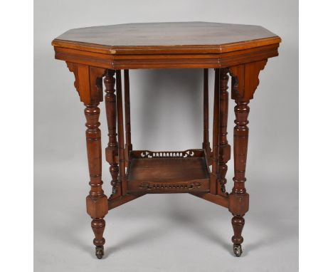 An Edwardian Mahogany Octagonal Occasional Table with Galleried Stretcher Shelf and Turned Support, 75cm Diameter 