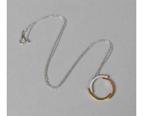 A Pretty 18ct Gold and Diamond Pendant, Broken Circular Form with White, Rose and Yellow Gold on an 18ct White Gold Chain 2.8