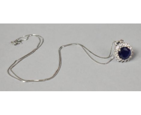 A White Metal and Sapphire Pendant, Central Sapphire approx 3.5cts, with White Sapphire Surround, on a Silver Chain 