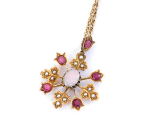 A Victorian opal, ruby and seed pearl pendant, of floral form, with a 9ct gold neck chain, on a bolt ring clasp, 7.8g. 