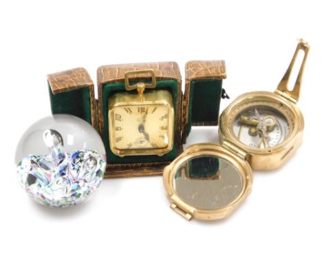 A French Art Deco brass cased travelling clock, with Arabic numeral dials and subsidiary seconds, keyless wind, and loop hand