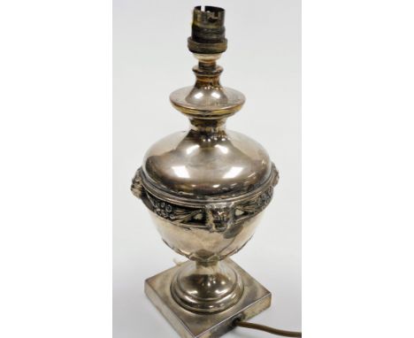 An early 20thC silver plated table lamp, of baluster form, with relief moulded lion mask decoration, on a square base, 31cm h