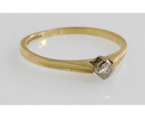 An 18ct gold and diamond solitaire ring, high claw set, approximately ⅛? carat, size K, 1.4g.