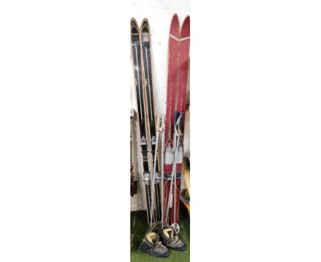 Two pairs of vintage skis and poles, for Marker Germany and Elan, 190cm long, and a pair of leather skiing boots. 