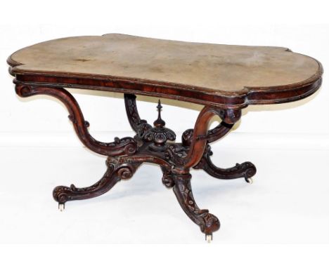 A Victorian walnut and burr walnut library table, the oval top with concave sides and rounded ends and a moulded edge, on fou