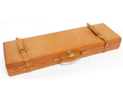 A leather gun case in light tan, with brass lock and fitted interior, 81cm.
