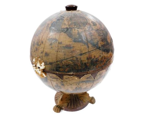 A tabletop terrestrial globe cocktail cabinet, label for Louis Cordedda, on a moulded plastic lion paw base, 56cm high. 