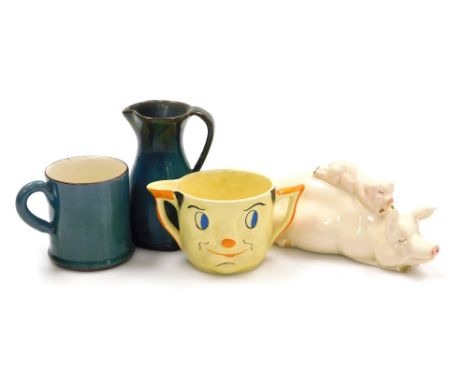 A group of ceramics, comprising a Beswick sow and pig figure group, 17cm wide (AF), a Carltonware mask jug, in yellow, 6cm hi