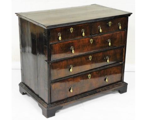 A William &amp; Mary walnut chest of drawers, the crossbanded and feather banded top with a moulded edge above two short and 