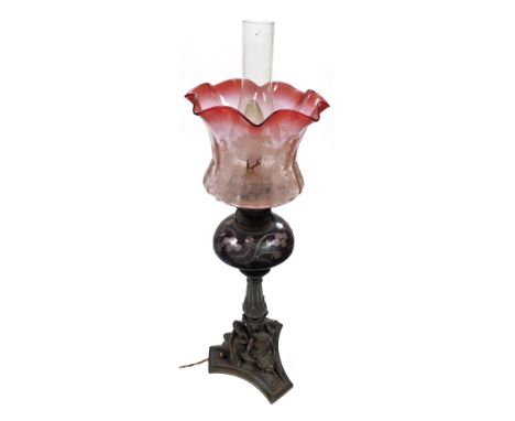 A late 19th/early 20thC Messengers Duplex no. 2 oil lamp, with a floral etched cranberry glass shade, ruby flashed glass cent