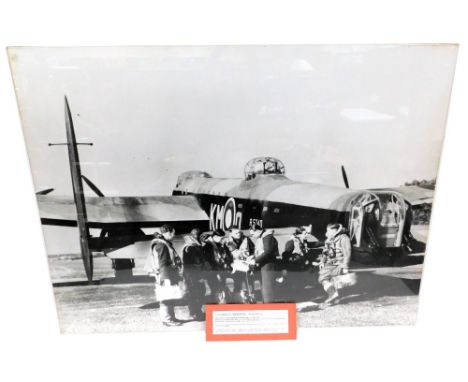 A photographic print of a Lancaster, R5740 (KN-0) and crew, mounted on board, 105cm x 138cm.  The R5740 was delivered to 44 s