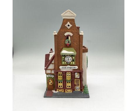 Handpainted matte porcelain building modelled as a two-story music shop. Part of the Christmas in the City Village Series. De