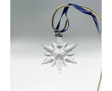 Sparkling star or snowflake shaped tree ornament in clear faceted crystal. Swarovski mark. This item has its original box: 5.