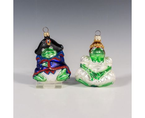 Exquisitely hand-painted glass ornaments depict Josephine and Napoleon. Josephine, the stately Frog Princess, exudes regal ch
